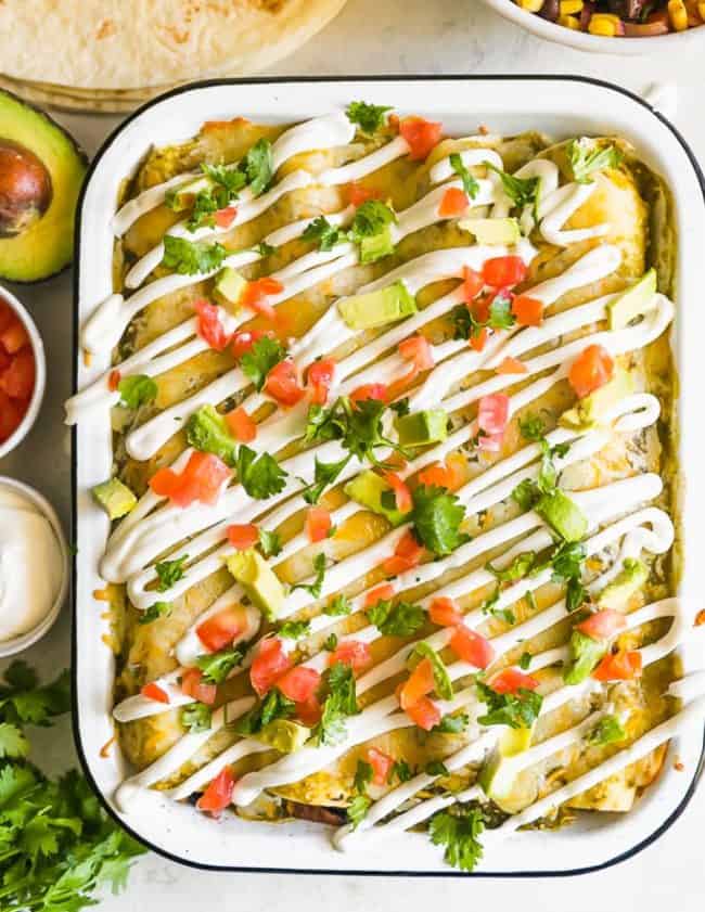 This HEALTHY CHICKEN ENCHILADAS Recipe(Chicken & Sweet Potato Enchiladas) are a healthy and delicious way to enjoy Mexican night! We love these tasty sweet potato black bean enchiladas and make them on the regular. This Skinny Chicken and Sweet Potato recipe is filled with vegetables and all kinds of good stuff. They are definitely a new favorite!