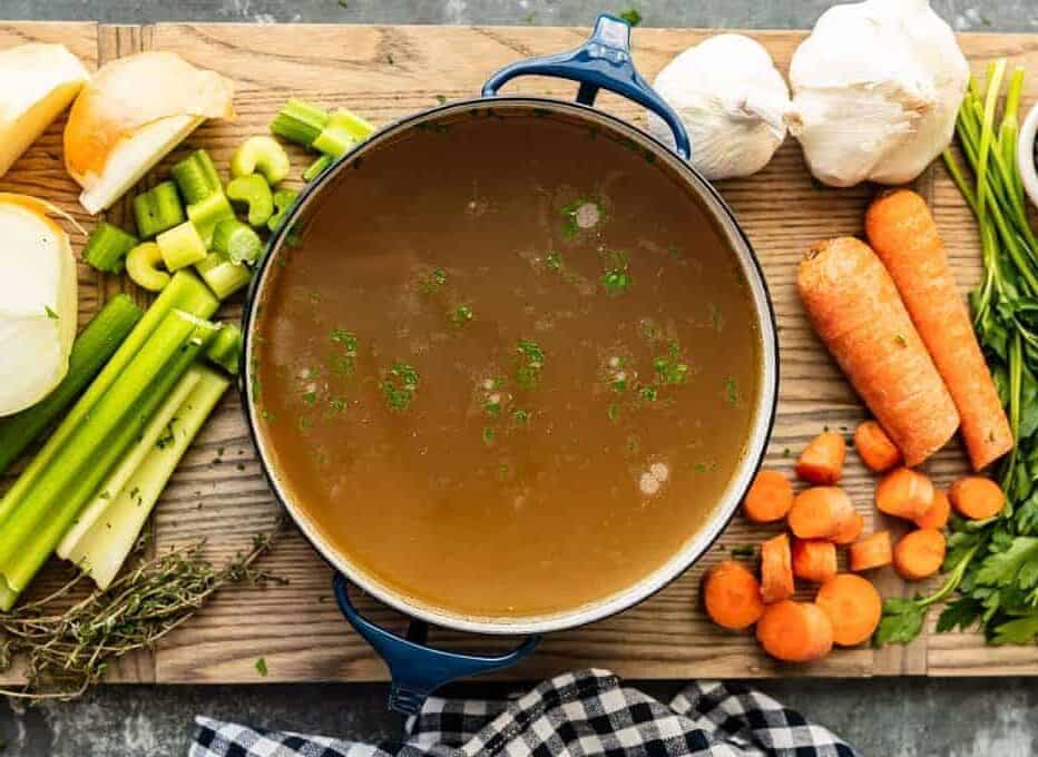 homemade chicken broth in stock pot