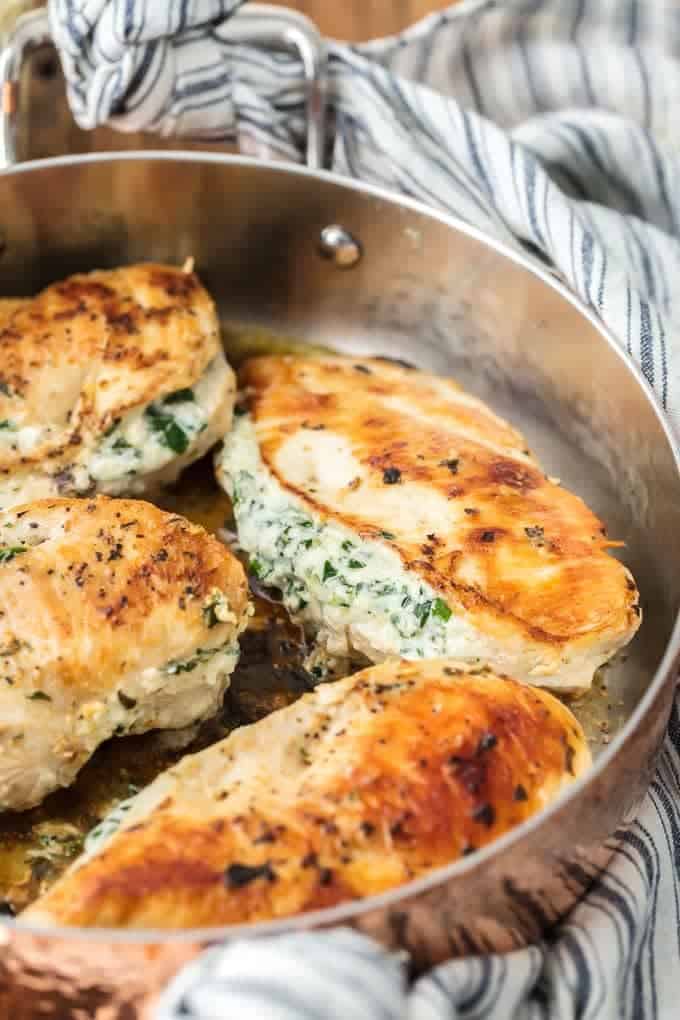 spinach stuffed chicken breast recipe in skillet side view