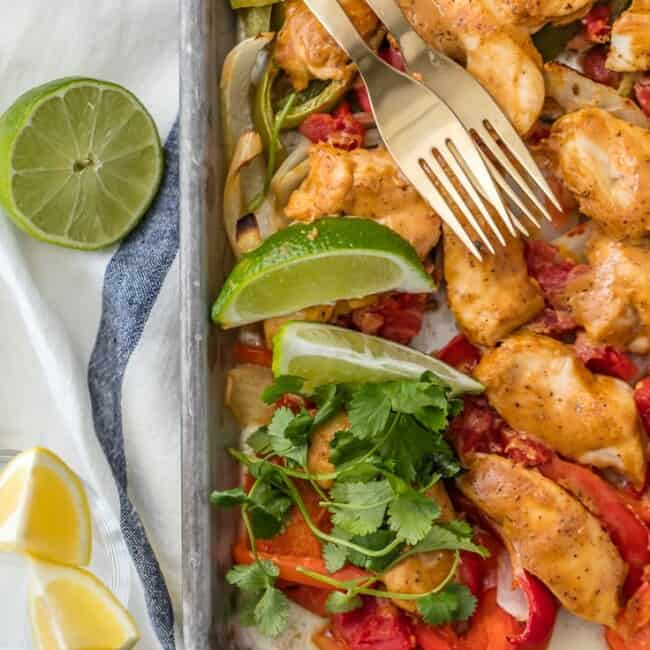 Sheet Pan Chicken Fajitas are one of our favorite healthy dinners! These baked chicken fajitas are lighter in calories and fat, but still packed with flavor. These healthy chicken fajitas are an easy sheet pan fajitas recipe that everyone will love. It’s the perfect dinner for two!