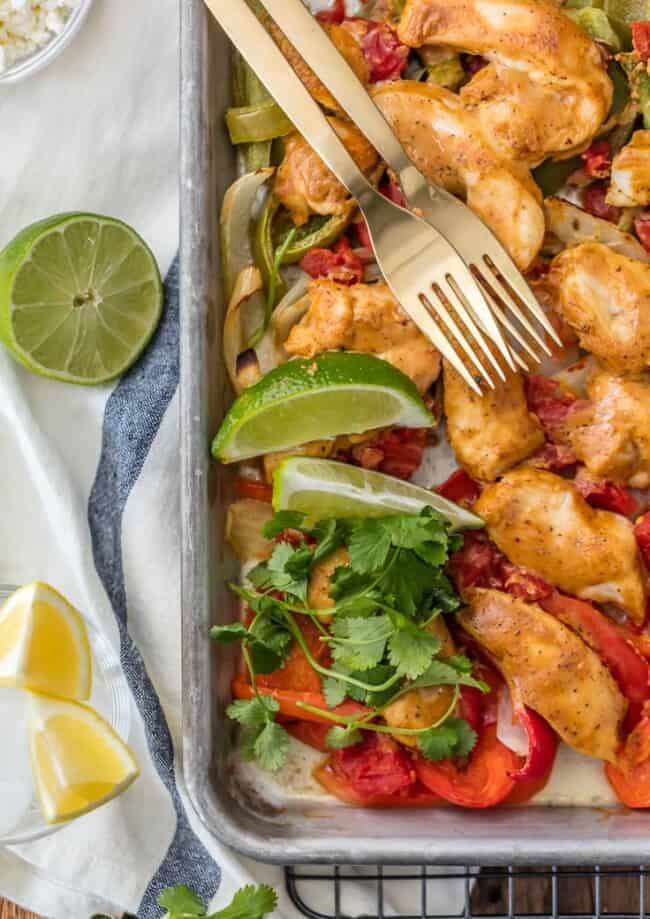 Sheet Pan Chicken Fajitas are one of our favorite healthy dinners! These baked chicken fajitas are lighter in calories and fat, but still packed with flavor. These healthy chicken fajitas are an easy sheet pan fajitas recipe that everyone will love. It’s the perfect dinner for two!