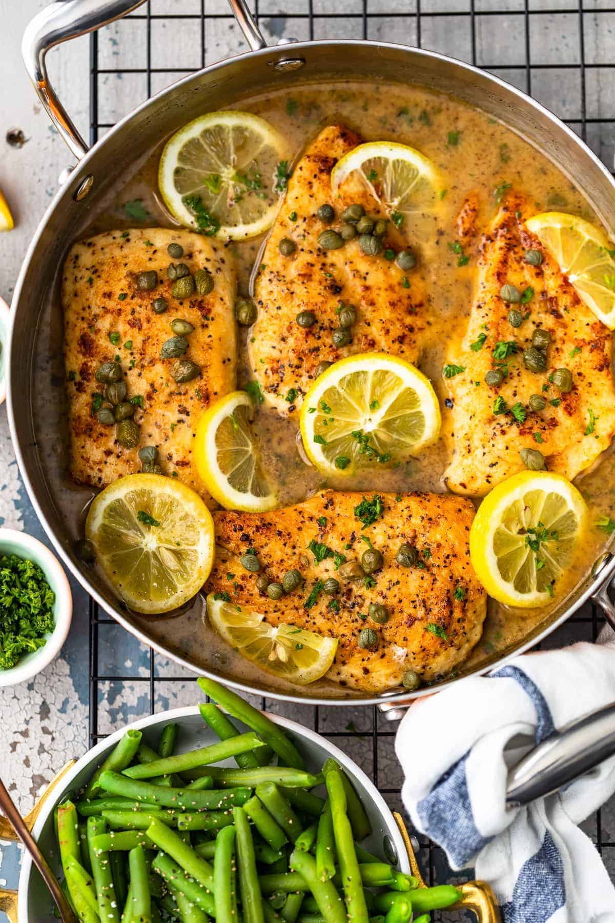Overhead shot of Easy Chicken Piccata in skillet with lemon white wine sauce