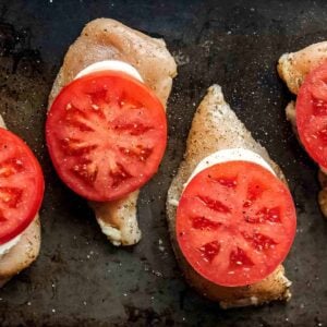 This Sheet Pan Chicken Caprese recipe is quick, easy, and even a little bit fancy. Easy Caprese Chicken is the perfect easy chicken recipe for busy weeknights! Five basic ingredients and one sheet pan are all you need to make this healthy Italian-inspired meal.