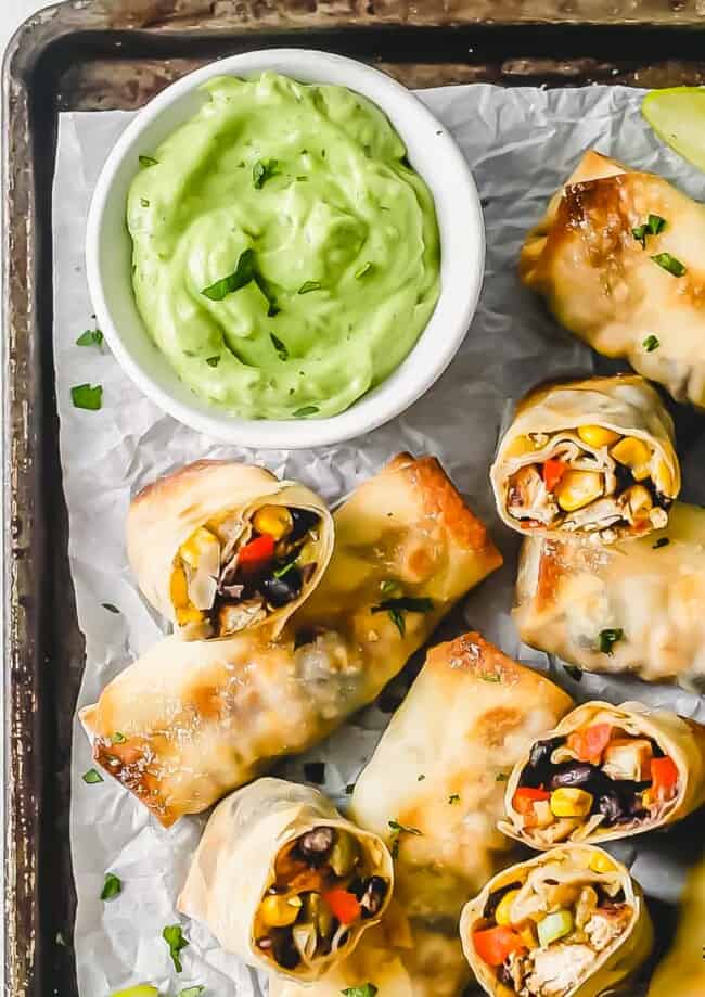 Baked Southwest Chicken Egg Rolls are packed with seasoned chicken and veggies, then baked until crispy and golden brown. Southwest Egg Rolls are served with an avocado dipping sauce, which is easy and perfect! This Baked Egg Rolls Recipes makes an outstanding appetizer to feed a crowd or a healthy after school snack!