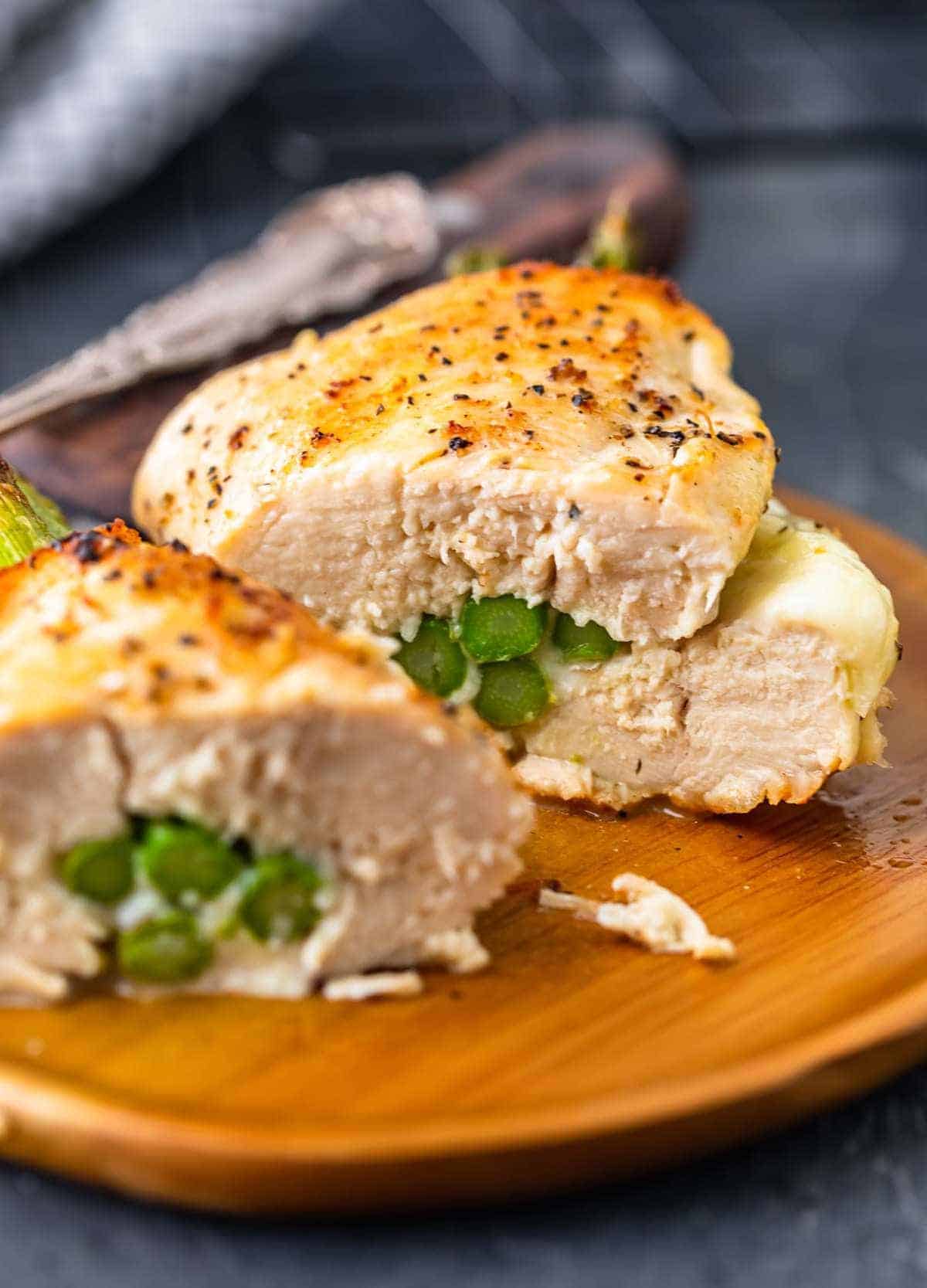 Cut Cheesy Asparagus Stuffed Chicken Breast on a plate