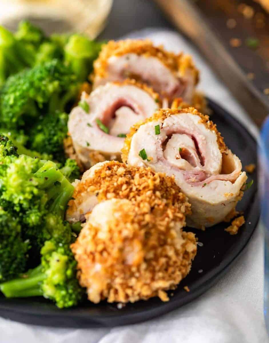 Baked Chicken Cordon Bleu is a delicious and healthy take on a classic chicken recipe. Layers of tender chicken, cheese, ham, and dijon sauce make this easy chicken recipe epic and a total mainstay.