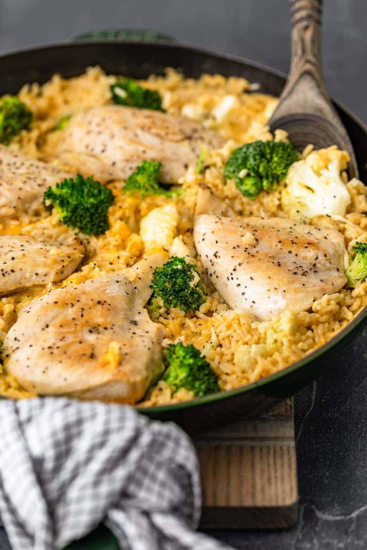 Cheesy Chicken and Rice with veggies in skillet side shot