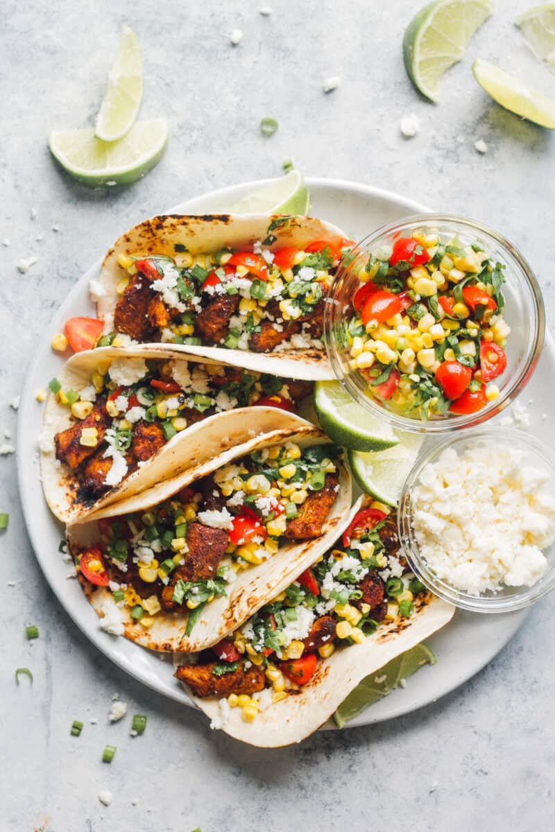marinated chicken tacos on plate with corn salsa