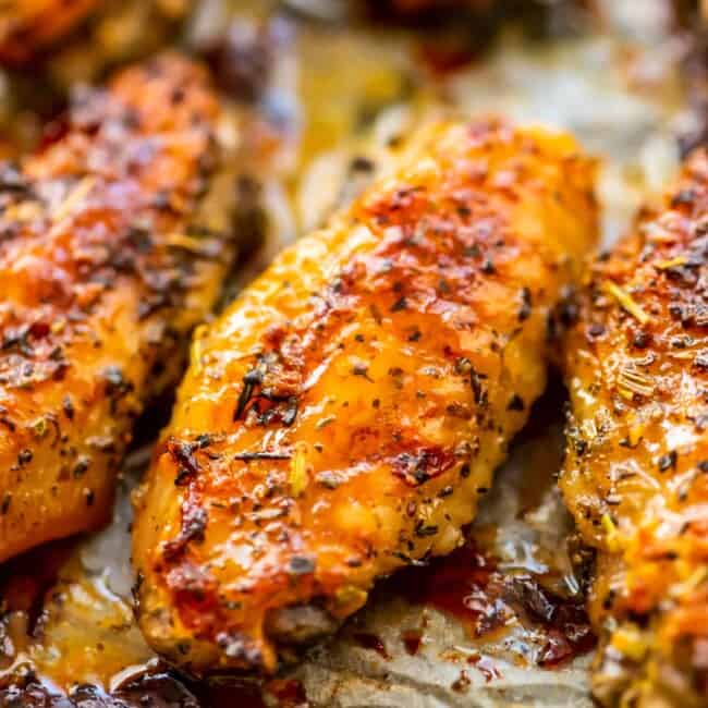 up close picture of baked chicken wings on parchment