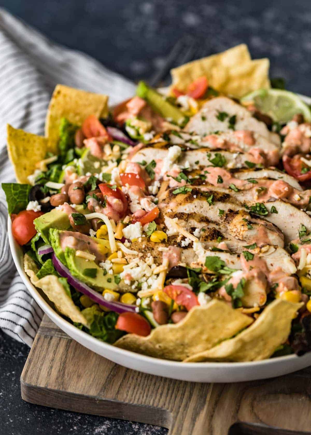 Chicken taco salad served in a large white bowl