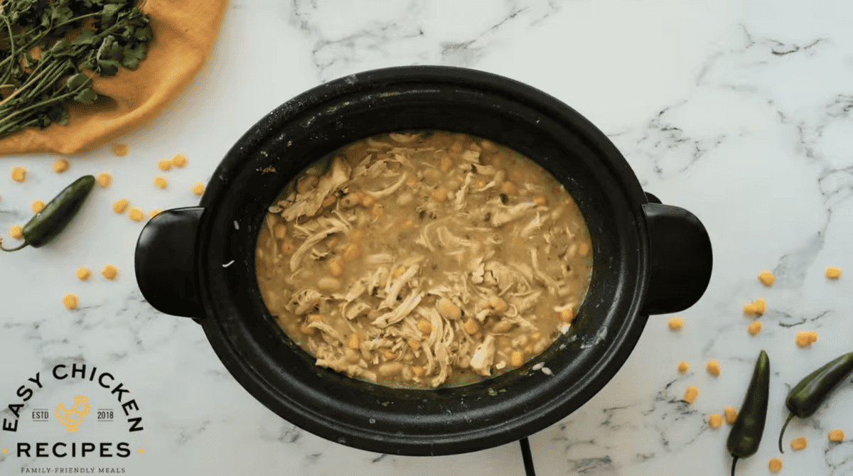 A slow cooker full of white chicken chili.