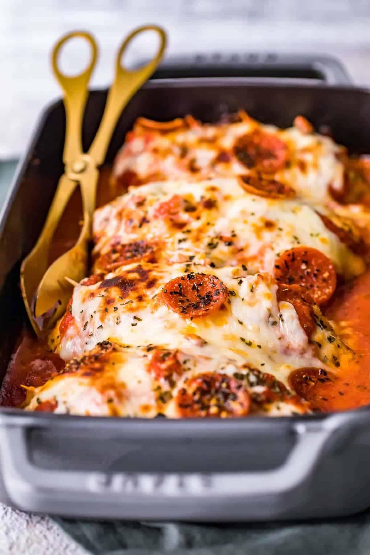 Cheese and pepperoni cooked on top of chicken breasts