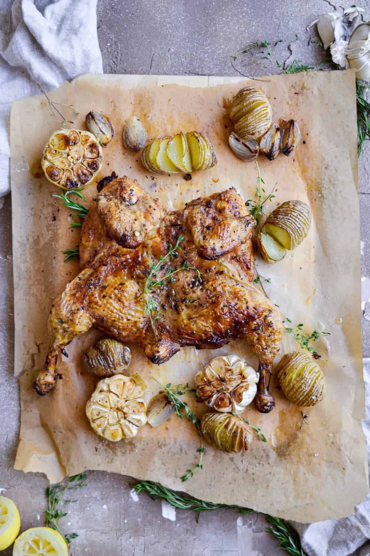 A roasted chicken on parchment