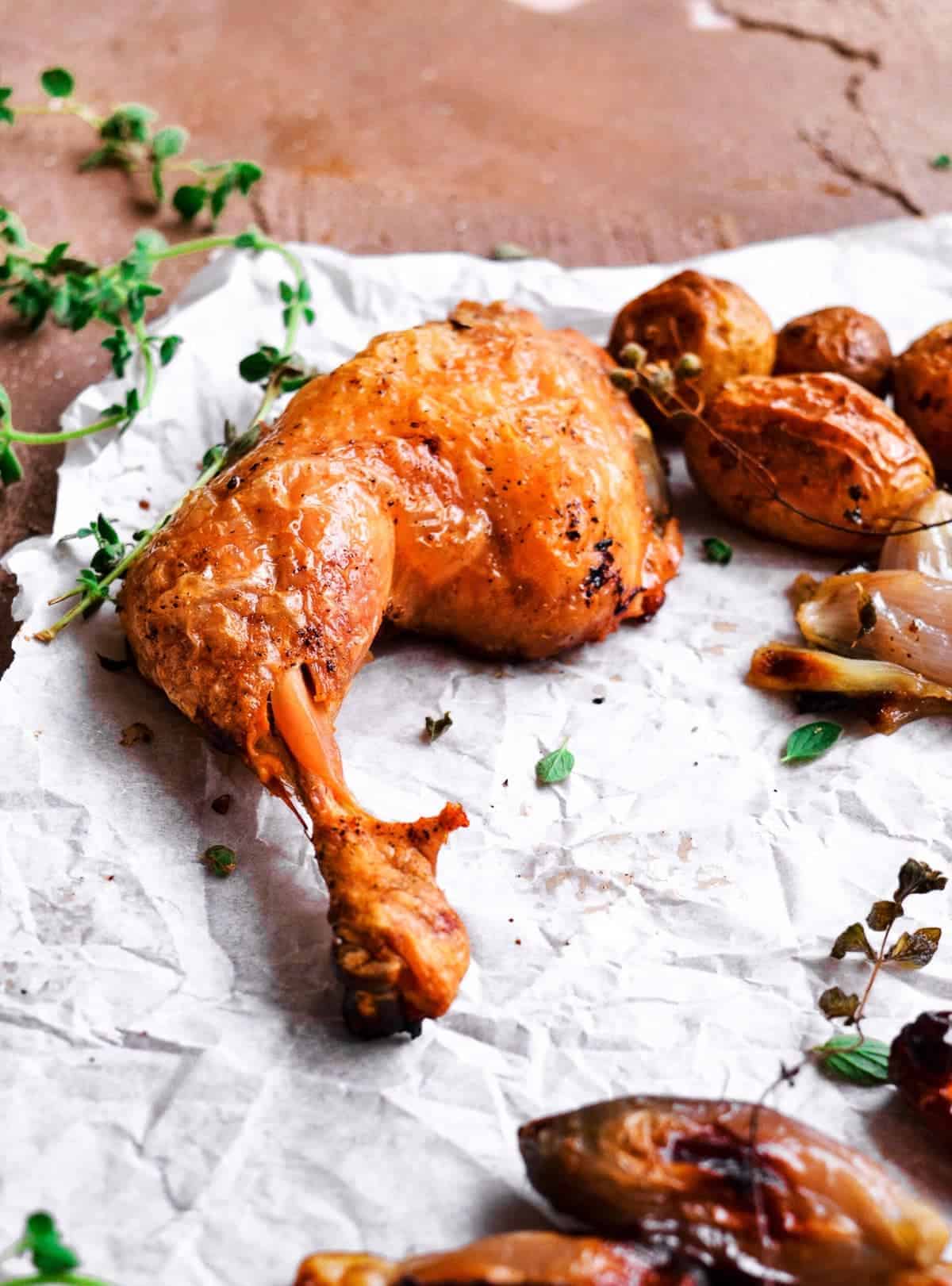 Baked chicken on parchment paper