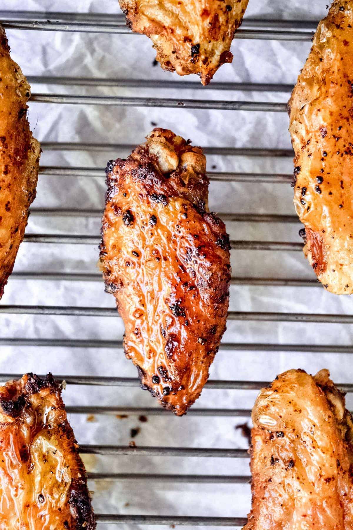 Baked chicken wings on a cooling rack