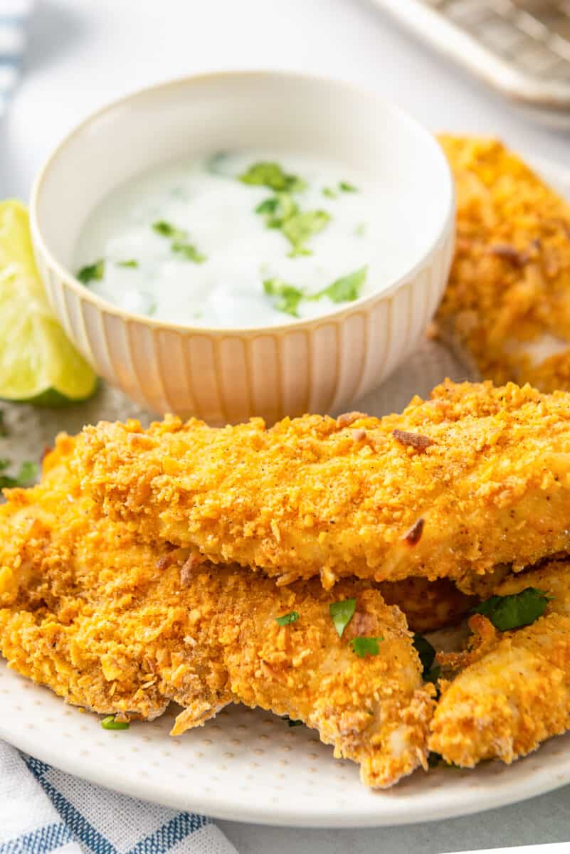baked chicken strips next to dipping sauce