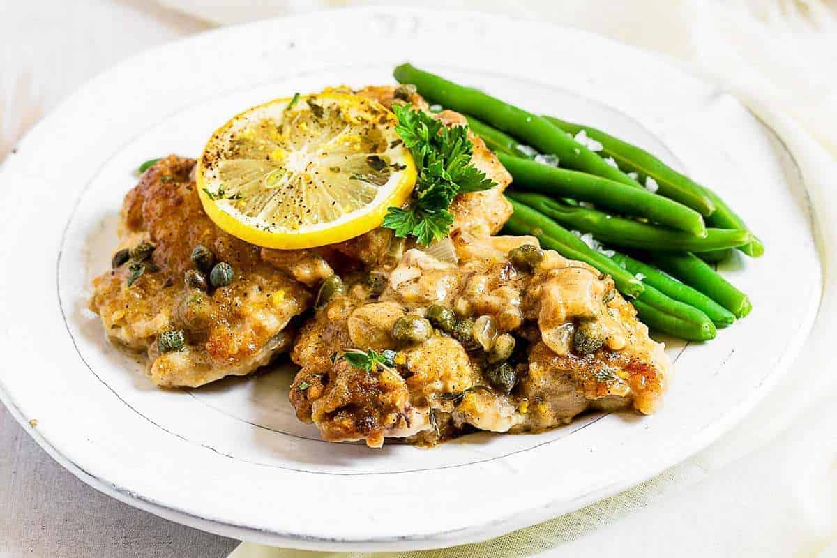 Creamy chicken piccata served with green beans