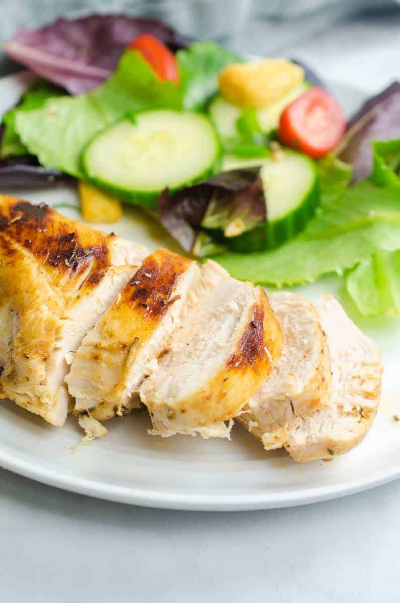 sliced chicken breast with salad