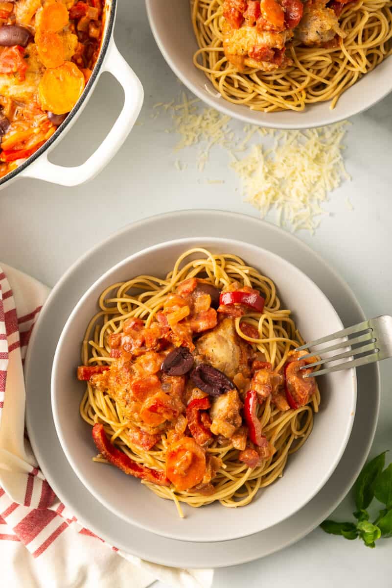 overhead image of chicken cacciatore served with pasta