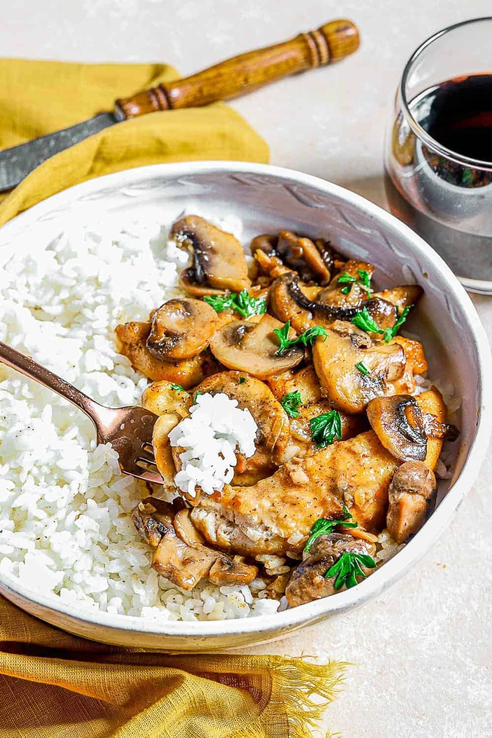 A mushroom and rice on a fork