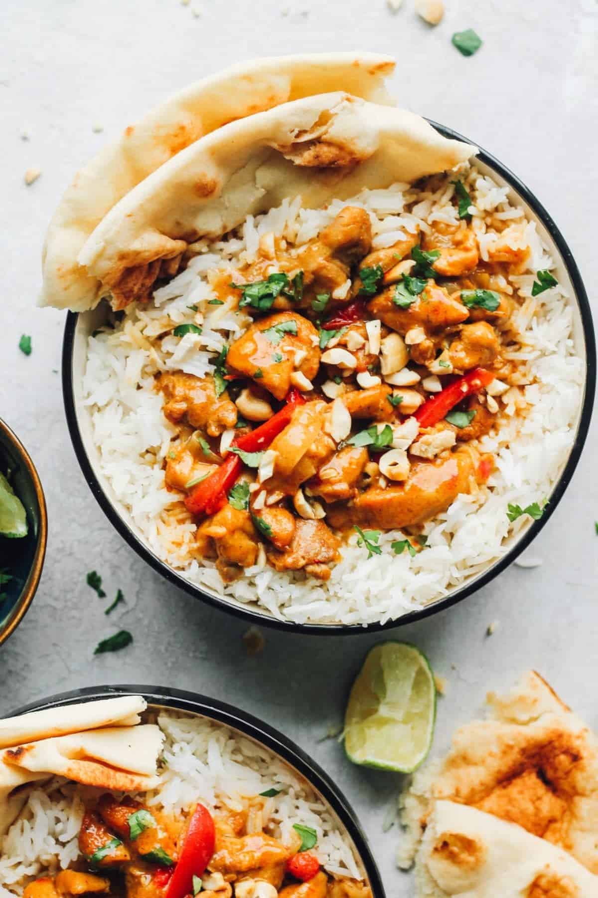 easy chicken curry served in a bowl with rice and naan