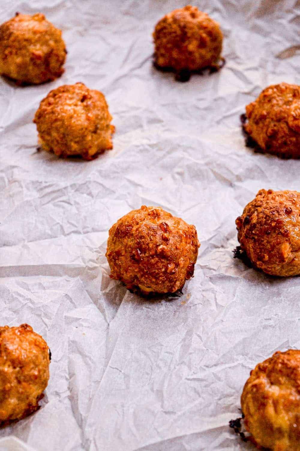 Baked meatballs on parchment