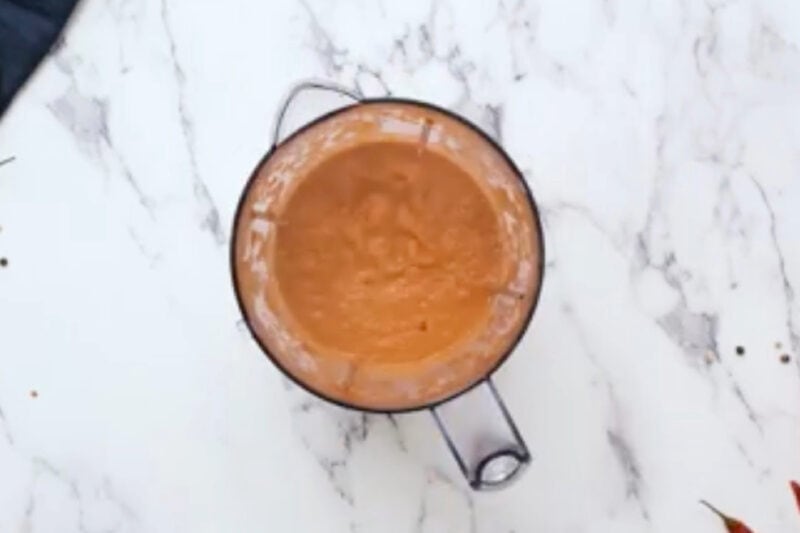 butter chicken sauce in a blender after blending.