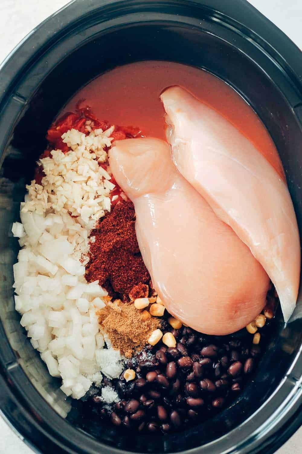 The ingredients in the slow cooker before cooking