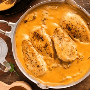 creamy sun dried tomato chicken in a skillet.