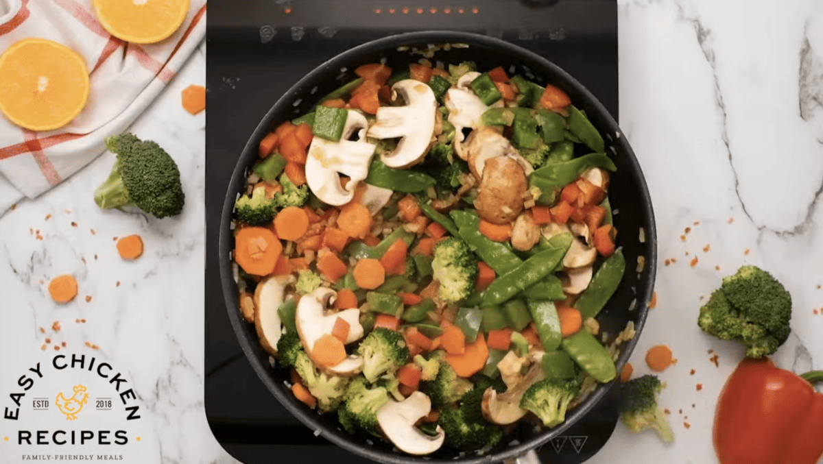 Vegetables are cooking in a pan. 