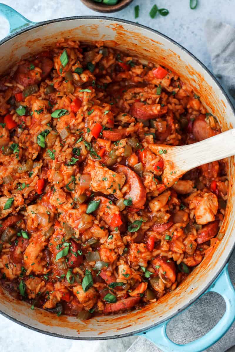 picture of cooked chicken jambalaya with rice and diced tomatoes on top