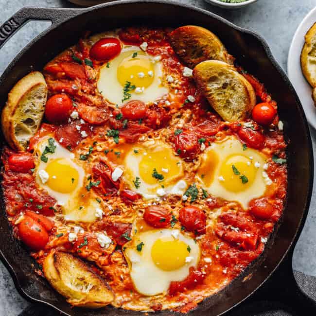 overhead view of shakshuka in a cast iron skillet.