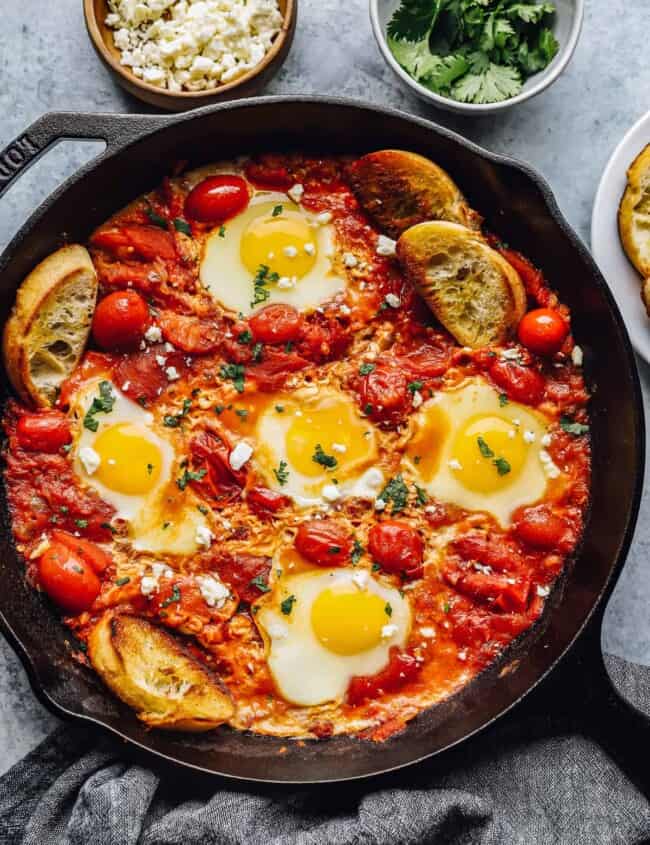 overhead view of shakshuka in a cast iron skillet.