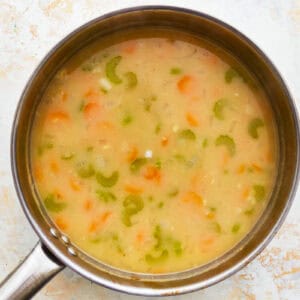 brothy soup in a pot.