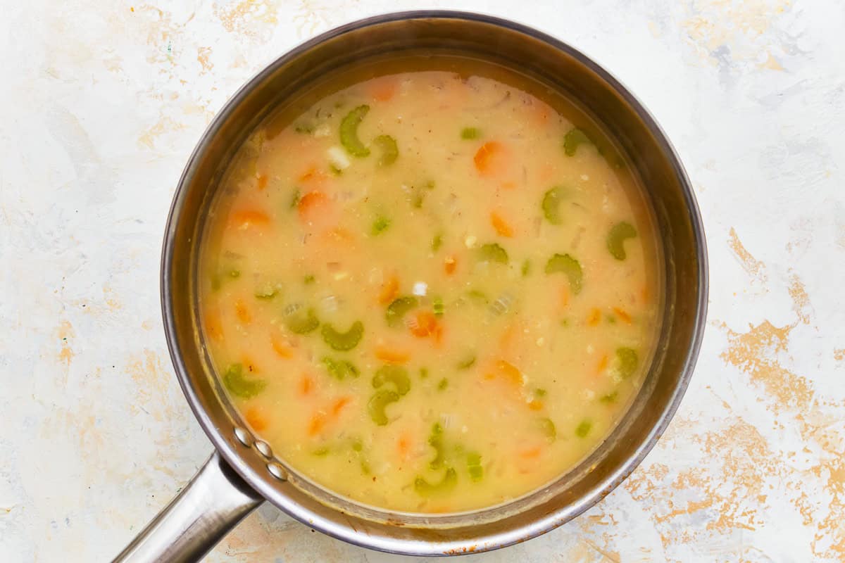 brothy soup in a pot.