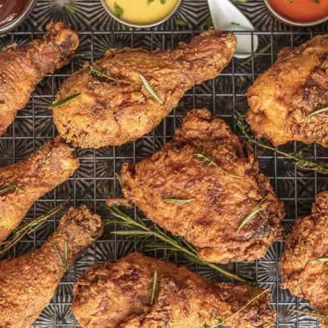 a group of fried chicken legs on a grid.