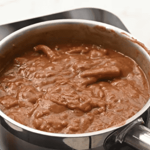 A pot is filled with all of the gumbo ingredients except for the meats.