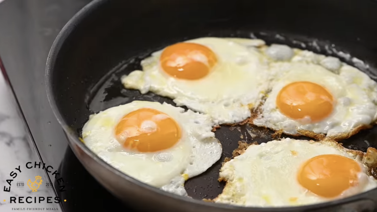 Eggs are frying in a pan. 