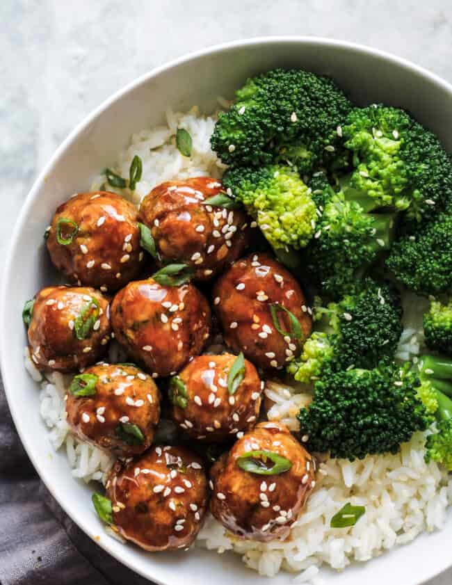 Asian chicken meatballs served with rice and broccoli