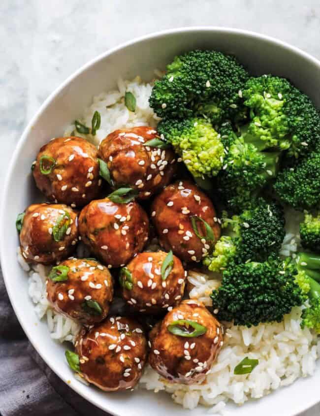 Asian chicken meatballs served with rice and broccoli