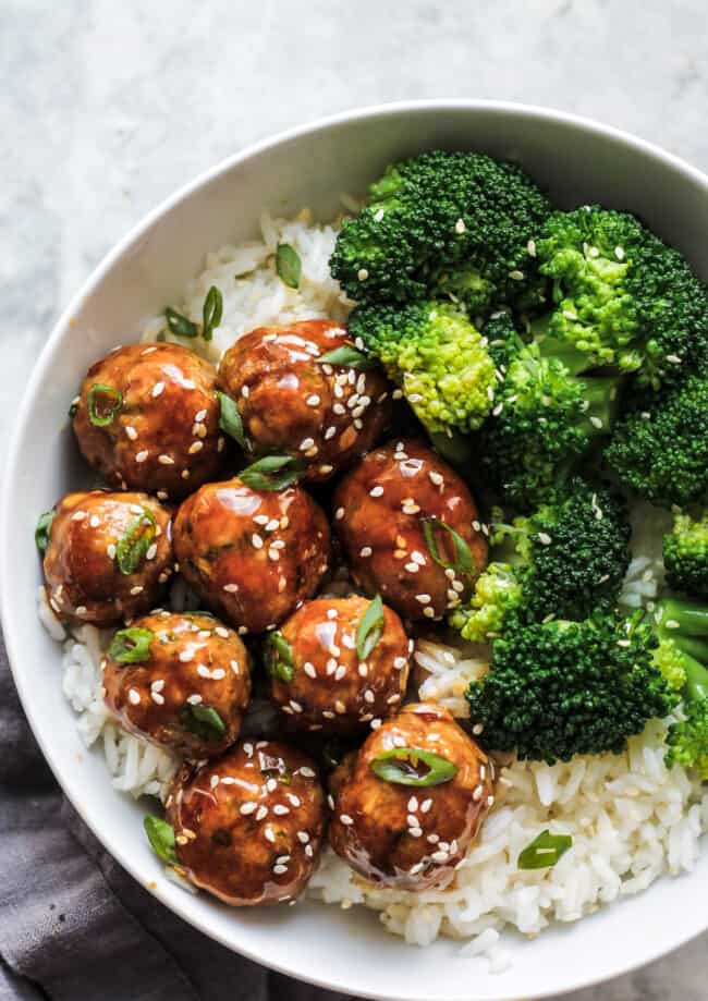 Asian chicken meatballs served with rice and broccoli