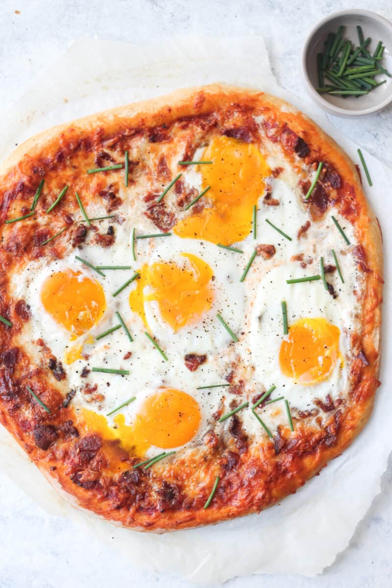 The baked breakfast pizza topped with fresh chives