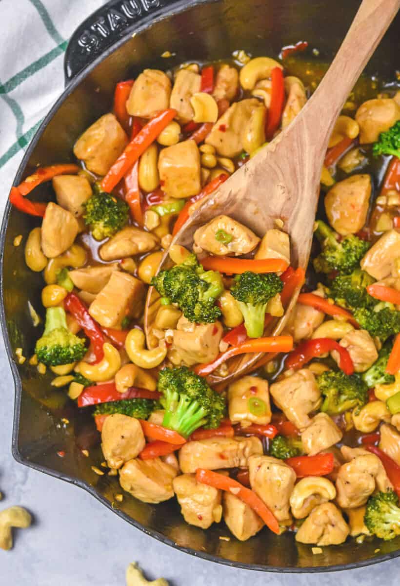 Chicken Teriyaki Stir Fry in a pan with a wooden spoon