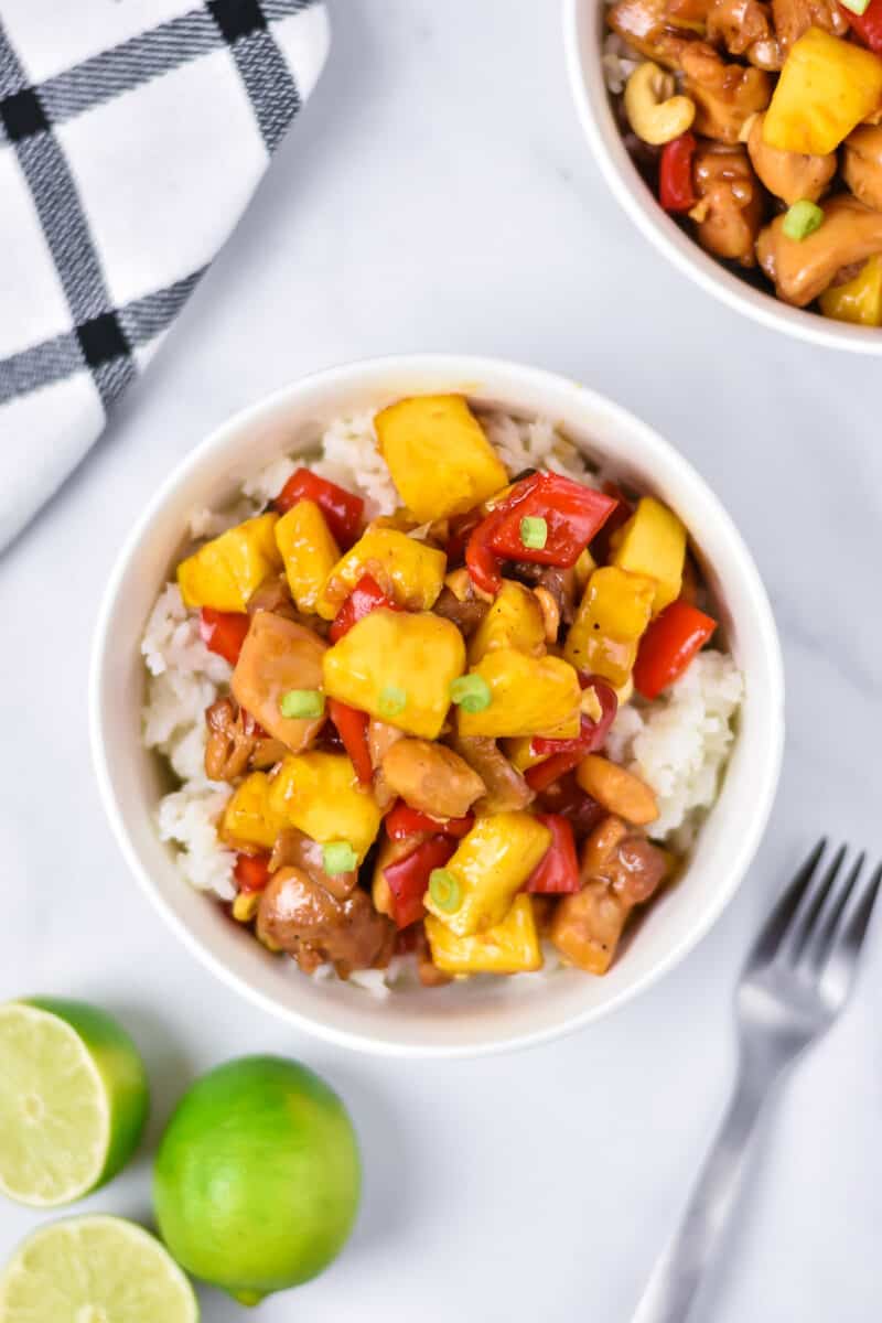 Pineapple chicken serve with rice in two bowls
