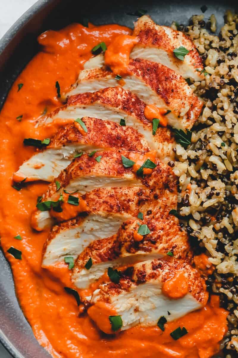 Close up of the sliced Romesco chicken
