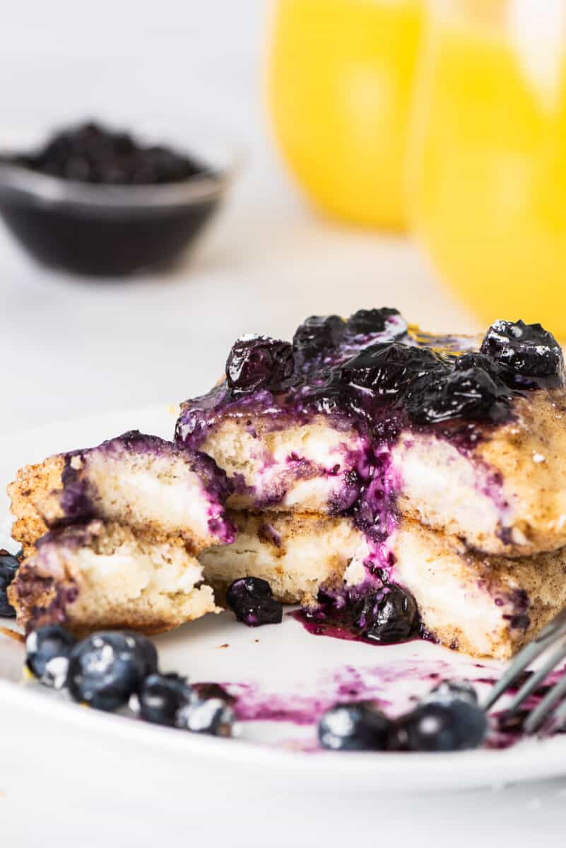 stuffed french toast with blueberry sauce on plate