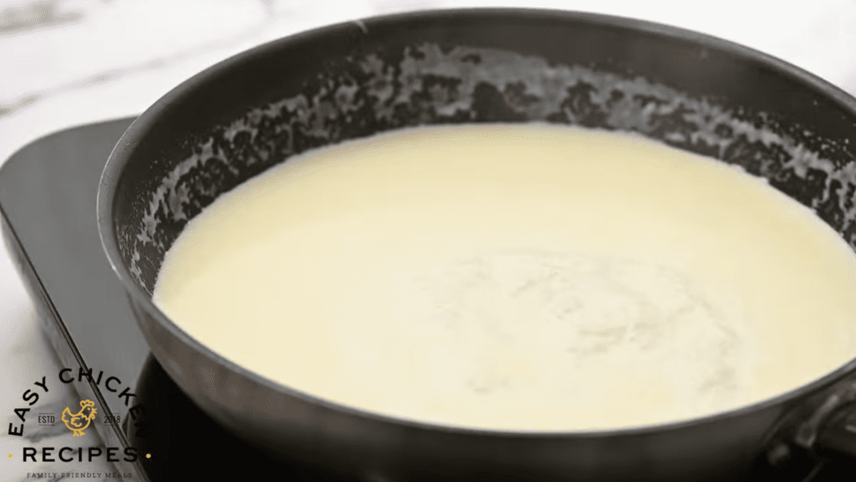 White sauce is in a skillet.