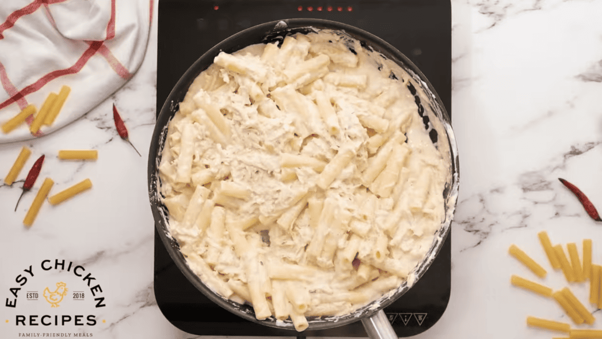 Pasta and chicken coated in a creamy sauce.