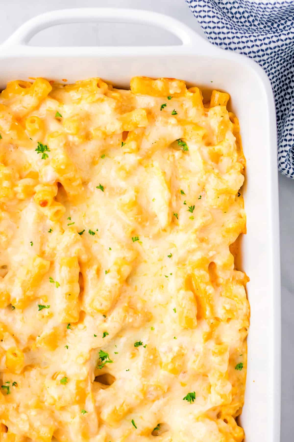 Overhead view of cheesy buffalo chicken pasta bake in a casserole dish.