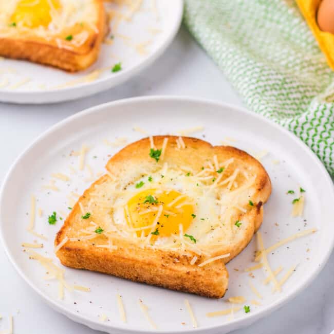 Two slices of toast with an egg on top, also known as Eggs in a Hole.